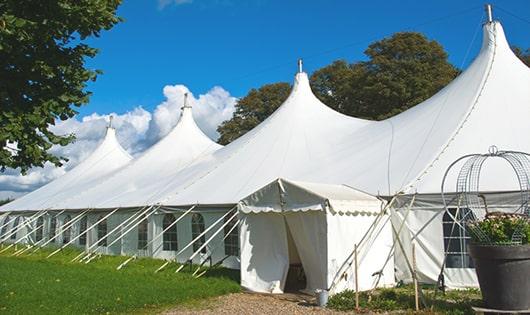 a line of sleek and modern portable toilets ready for use at an upscale corporate event in Belton